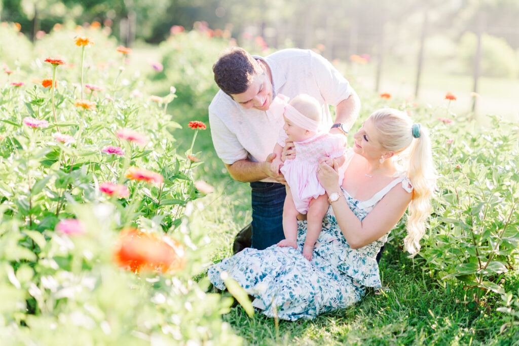 family photo shoot with zinnia flowers at piney meadow farm in huntsville texas