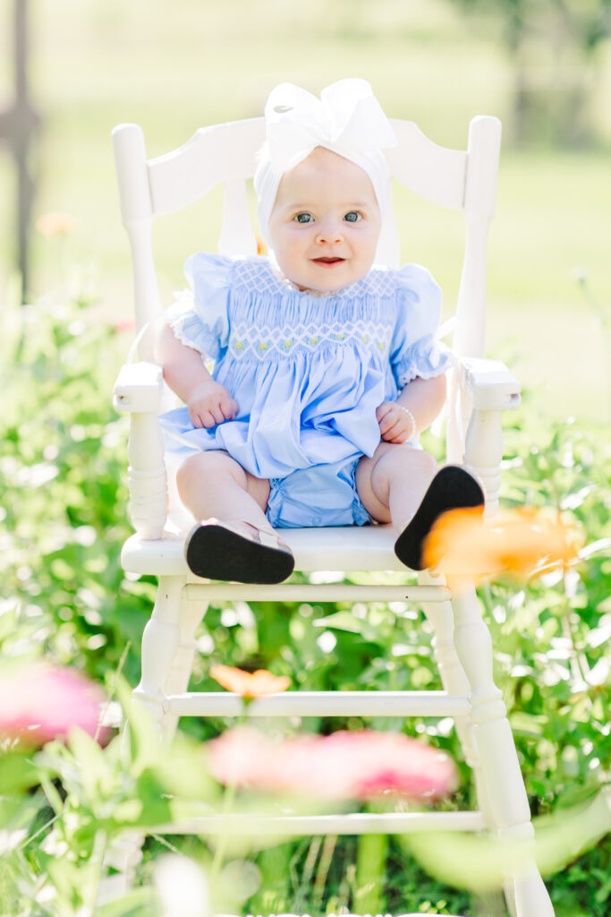 baby photo shoot with zinnia flowers at piney meadow farm in huntsville texas