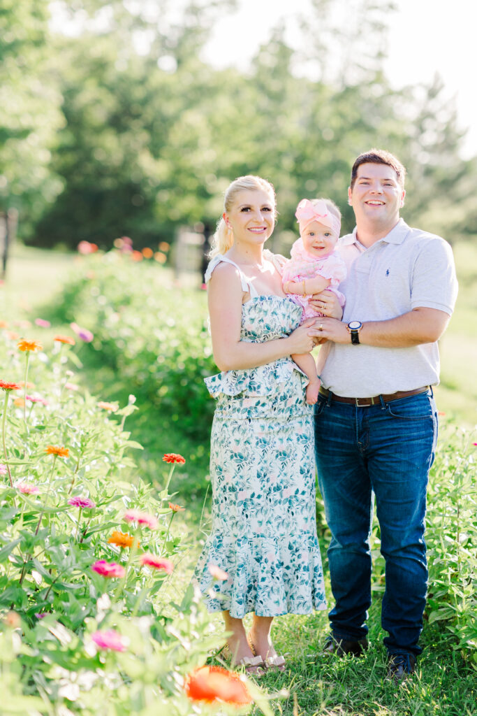 baby photo shoot with zinnia flowers at piney meadow farm in huntsville texas