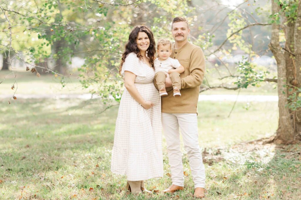 family snuggles together for houston family photos in boutique outfits